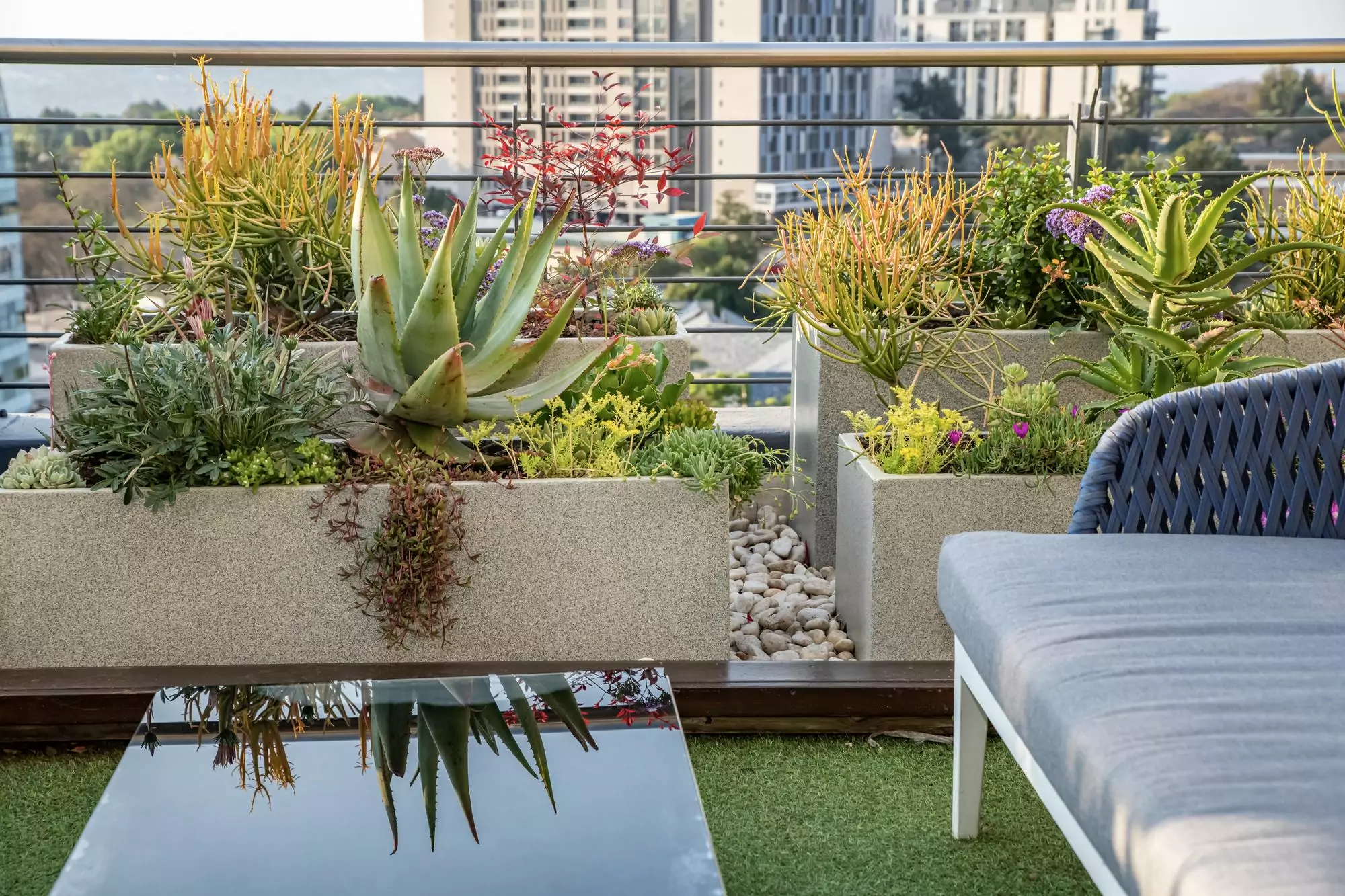 The Pot and Planter troughs styled on a balcony